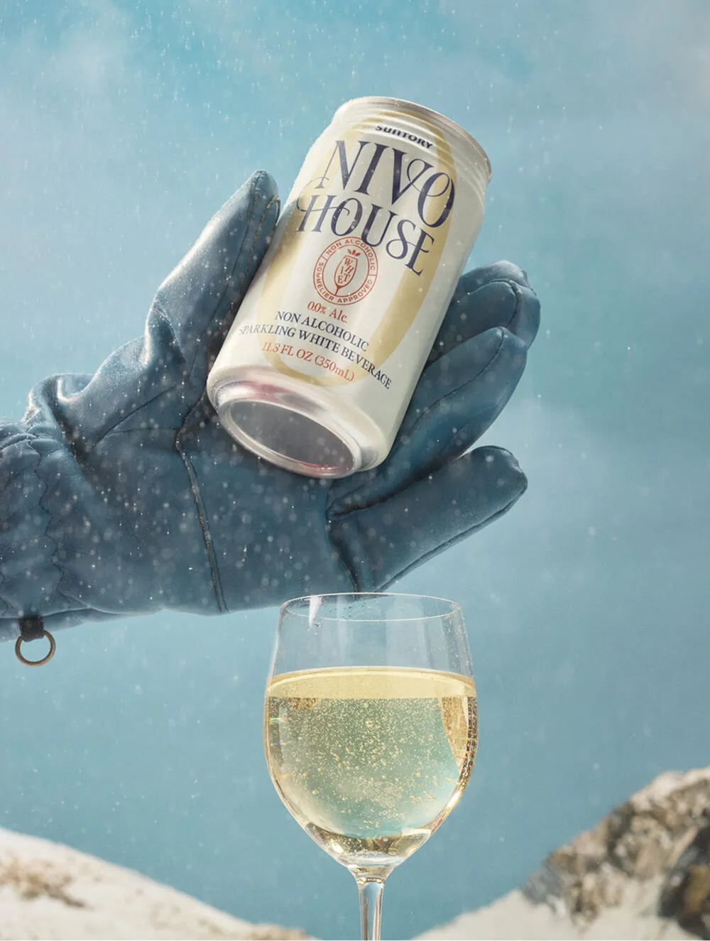 gloved-hand-pour-white-glass-snow